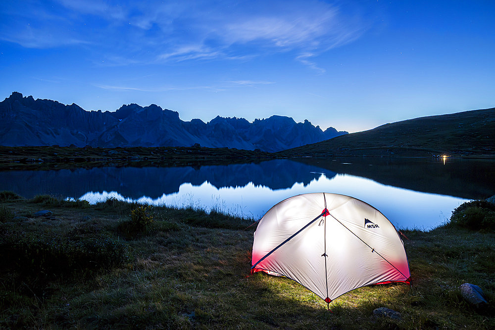 Bivouac on the shore of Lake Laramon (2359 m), Queyrellin ridge (2866 m) in the background, upper Claree valley, Nevache, Hautes-Alpes, France