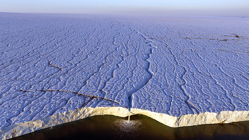 Glacial stream and fall on the polar cap, Brasvellbreen, Svalbard, Arctic