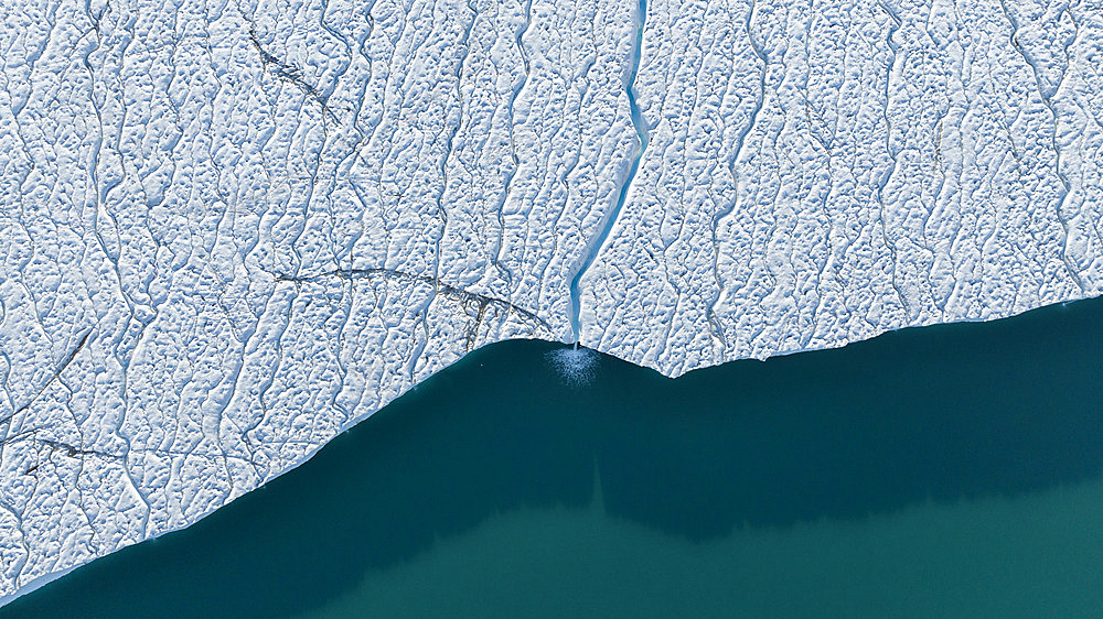 Glacial stream and fall on the polar cap, Brasvellbreen, Svalbard, Arctic