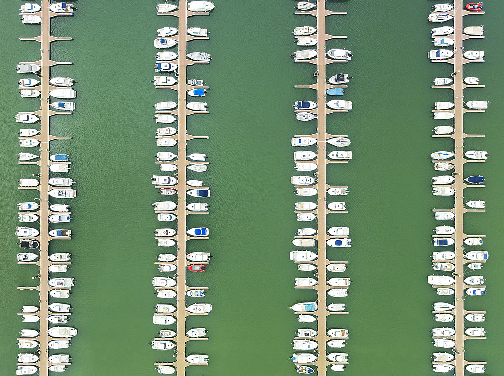 Marina wharves at the river mouth of the Piedras River. Aerial view. Drone shot. Huelva province, Andalusia, Spain.