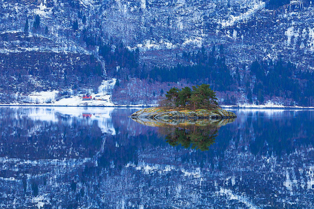 Islet in the middle of Krokafjorden opposite Luster in the great fjords of southern Norway. Bergen region.