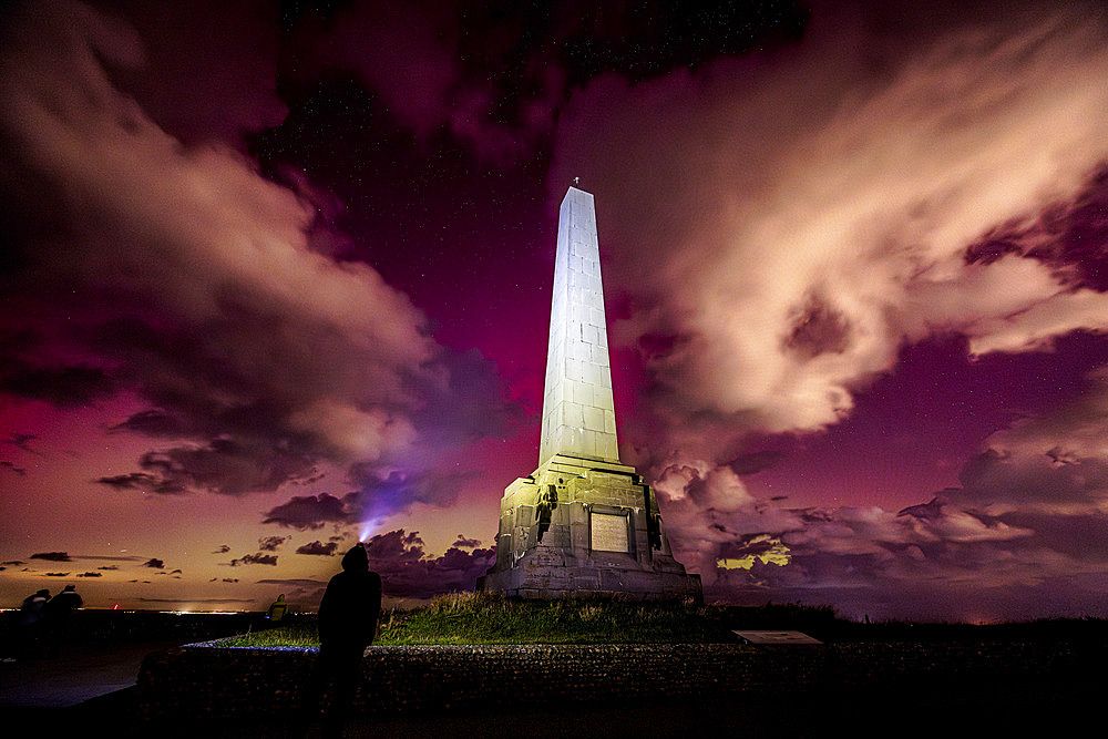 Aurora borealis in front of the Dover Patrol monument at Cap Blanc-nez, Cote d'Opale, France, October 10, 2024