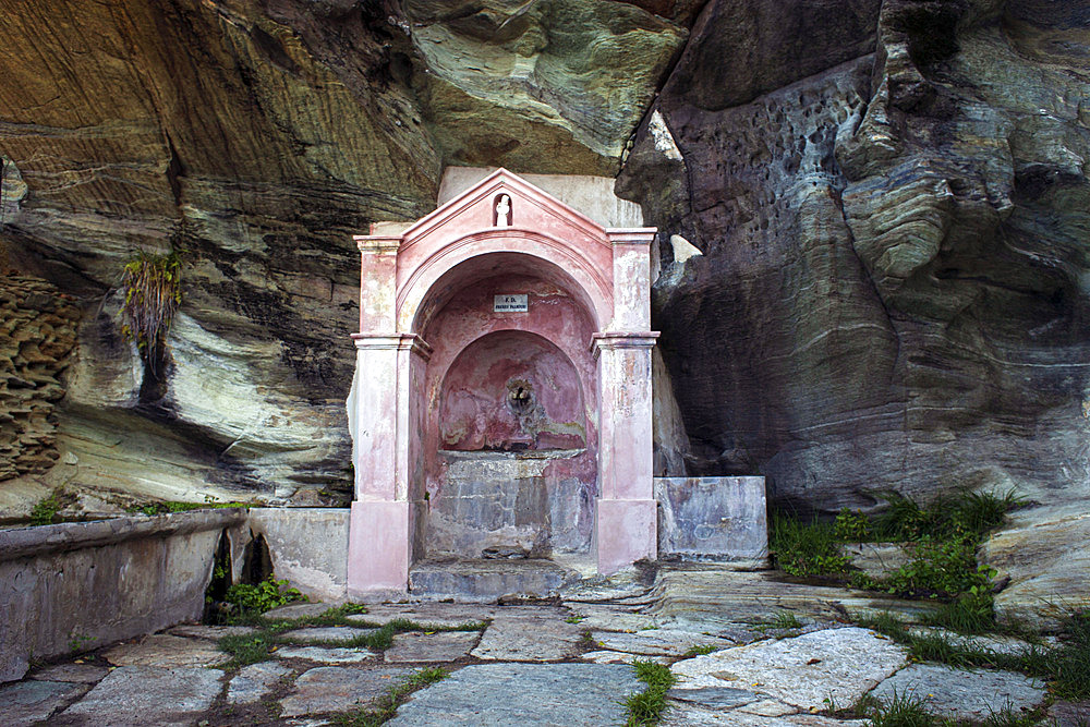 Palmieri fountain and washhouse, built in the 19th century beneath an impressive schist wall. The village is not very touristy, but it is nonetheless a magical place with the look of a medieval film. Cannelle, Corse-du-Sud, France