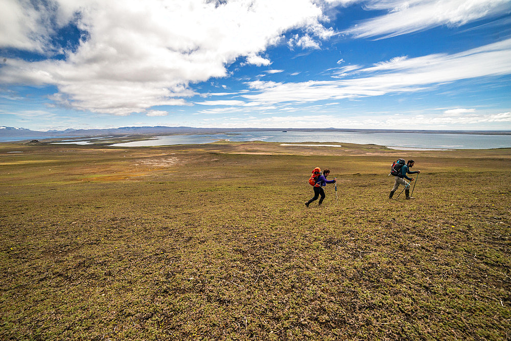 Alexia and Arthur. Two scientists walk from the Port-aux-Francais base to the Pointe Suzanne hut. Kerguelen Islands