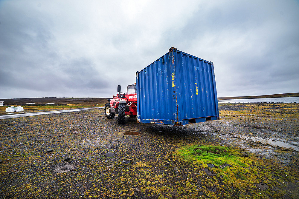 Loading a container onto a tray to move it to another location at the Port-aux-Francais base. Kerguelen Islands