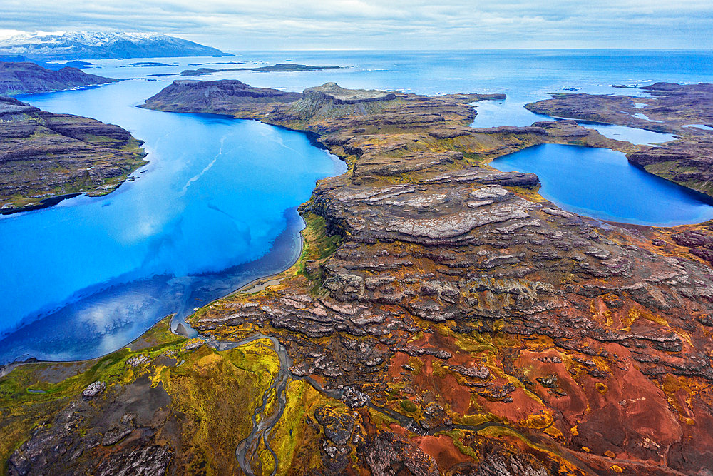 Over the Entrecasteaux peninsula. Left, Anse Duguay-Trouin. Right, Anse Grimaldi. In the background, Baie d'Audierne. Rallier du Baty peninsula, Kerguelen archipelago.
