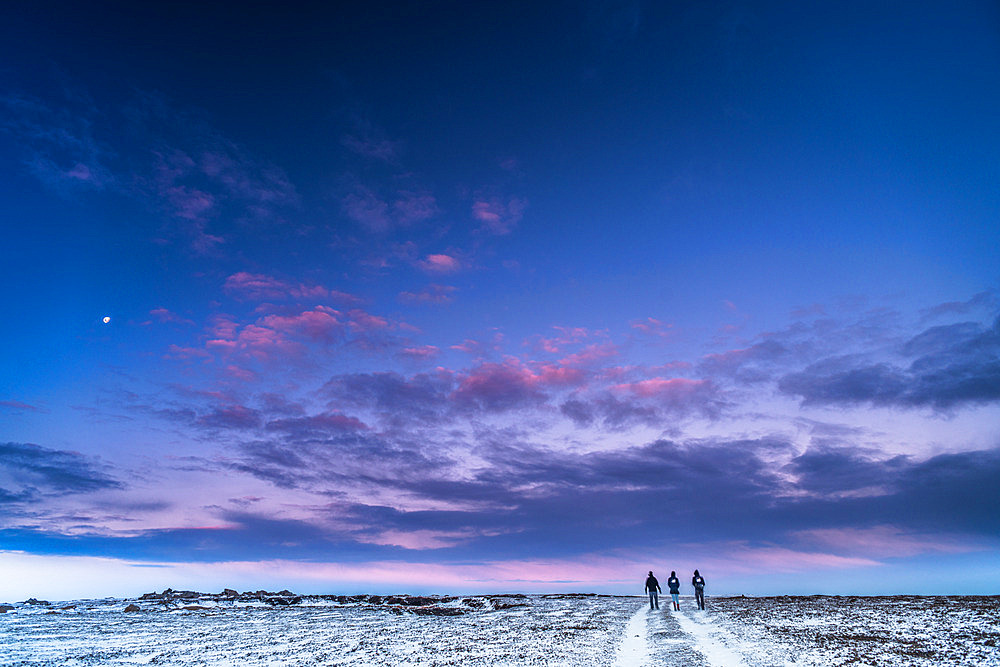 Three overwinterers return to the Port-aux-Francais base from Anse des Pachas. Courbet Peninsula, Kerguelen archipelago.