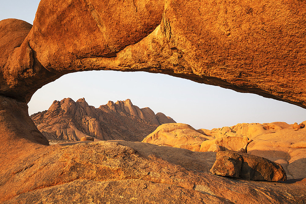 The Pondok mountains seen through "The Bridge" belong to the Spitzkoppe mountain compound. Damaraland, Namibia.