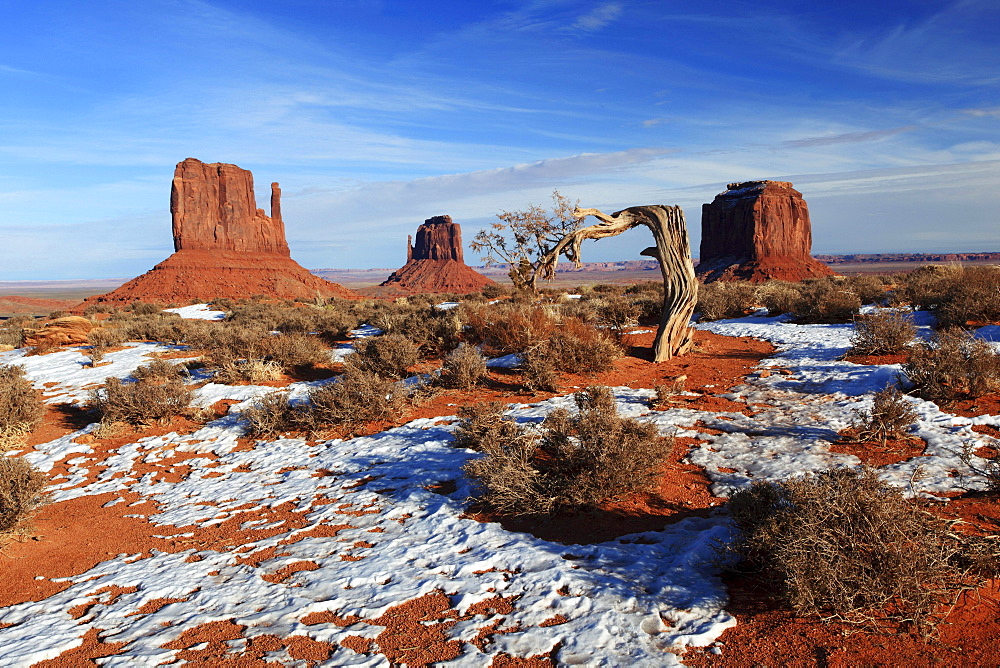 Monument Valley rocks stones Mitten Buttes and Merrick's Butte formed by weathering in snow winter erosion United States United States of America North America America