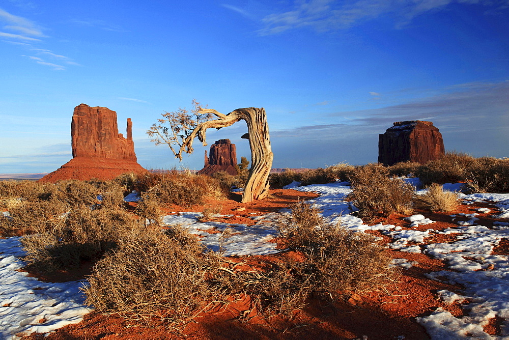 Monument Valley rocks stones Mitten Buttes and Merrick's Butte formed by weathering in snow winter erosion United States United States of America North America America