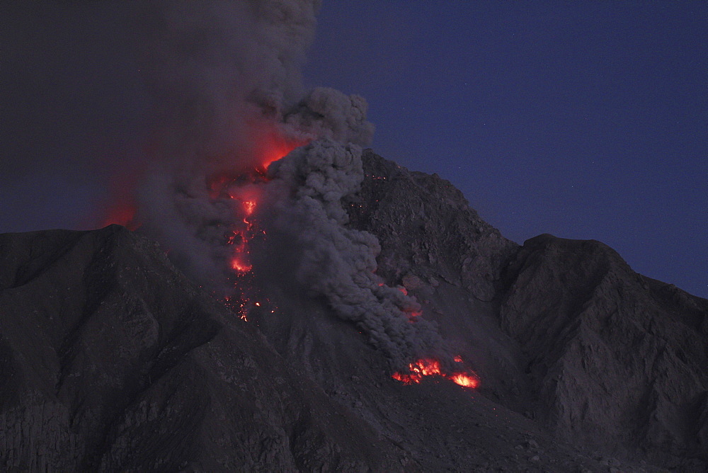 volcano Soufriere Hills volcanic eruption ash cloud pyroclastic power during the evening Montserrat Caribbean