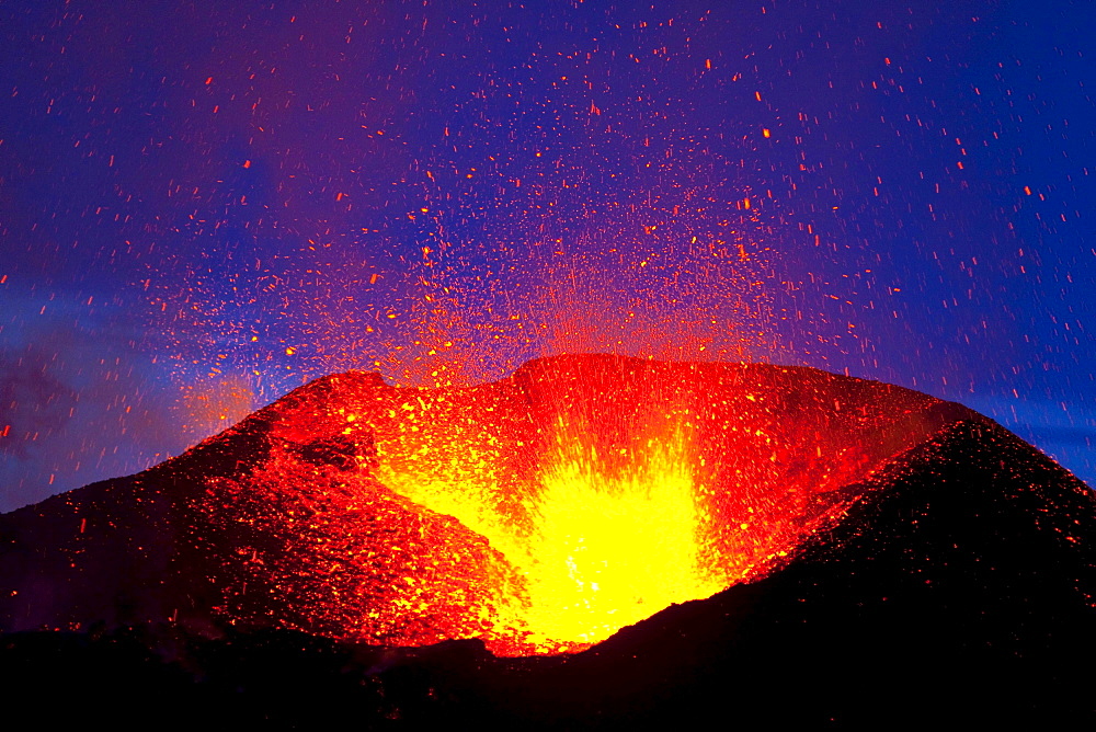 volcanic eruption fiery column and smoke over volcano crater night shot long exposure Eyjafjallajokull April 2010 Fimmvorduhals South Iceland Iceland Europe