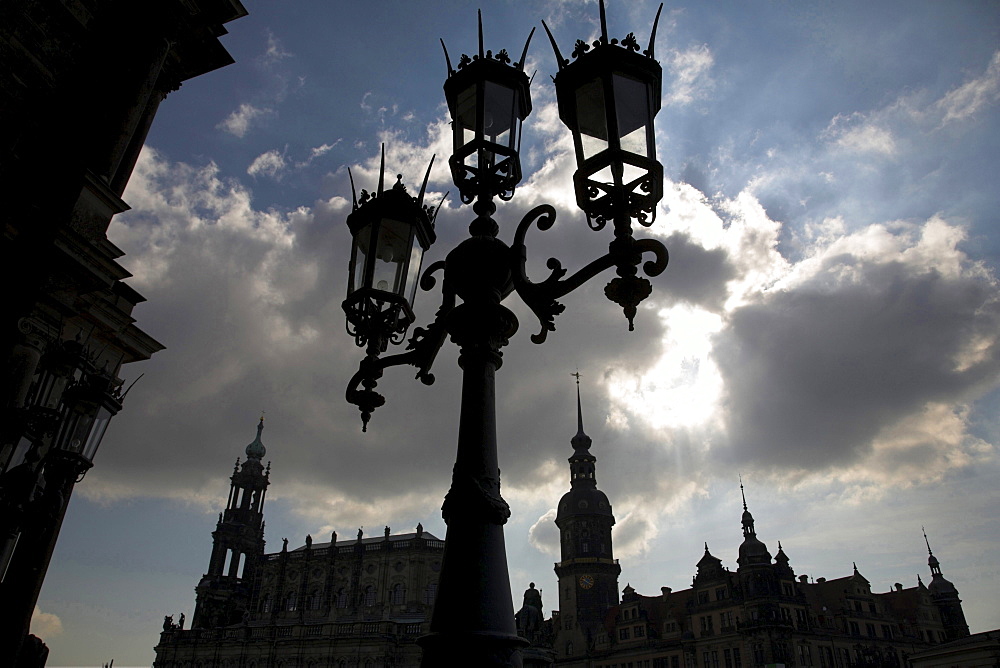 old historical church Katholische Hofkirche on the left and Dresden Castle on the right cloudy sky Dresden Saxony Germany