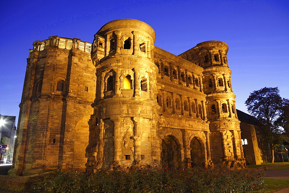 historical city gate Porta nigra illuminated at night