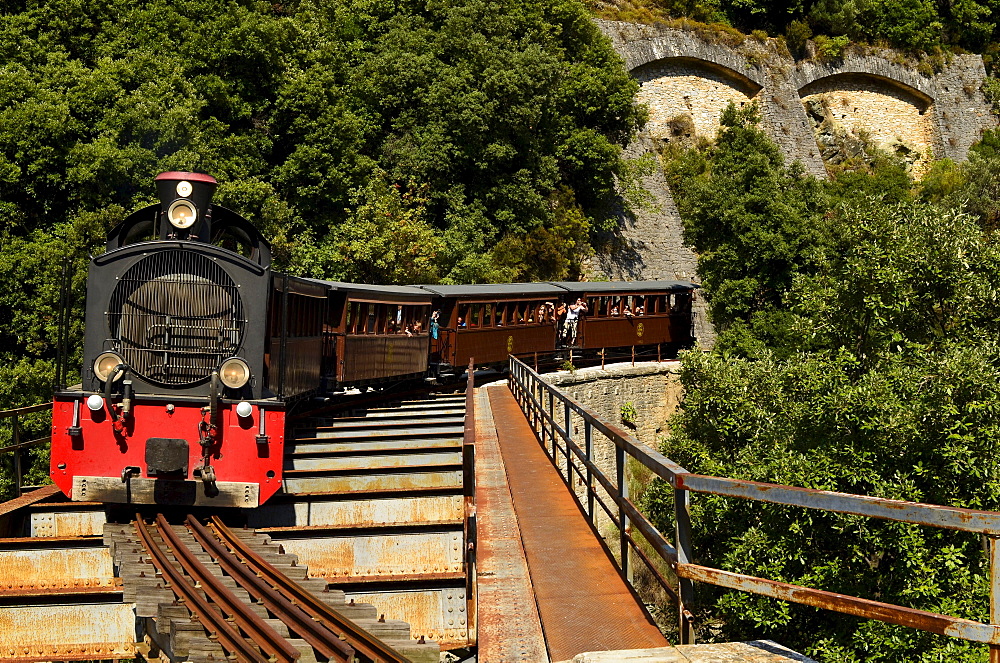 old historical Pelion train crossing a bridge