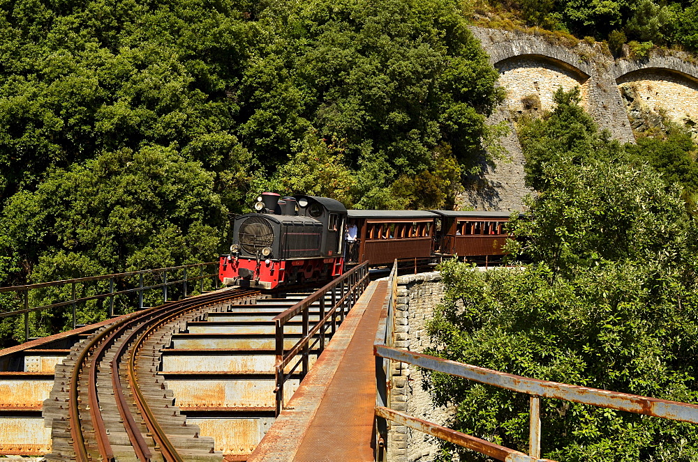 old historical Pelion train crossing a bridge