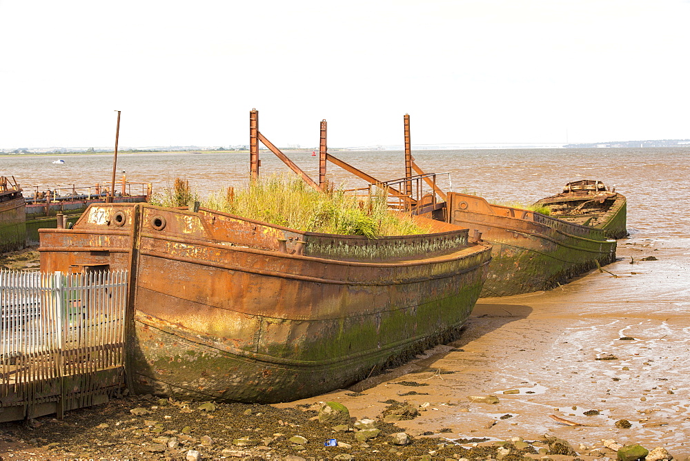 Old ship hulls being used to provide shelter to a ship yard at Salt End on the Humber Estuary, near Hull, Yorkshire, UK.