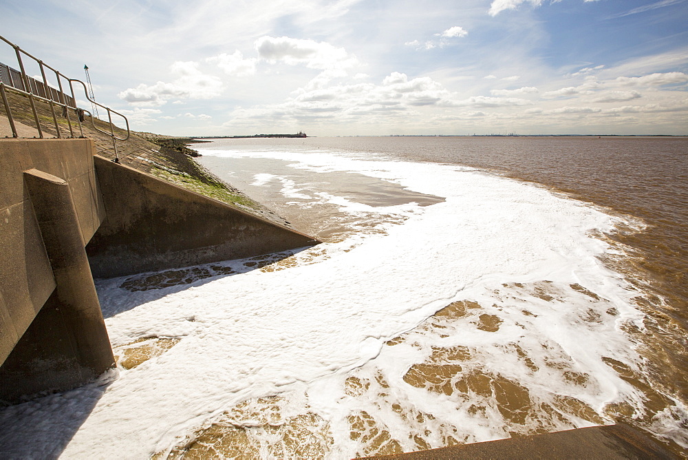 Contaminated water being emptied out of Finland Docks in Hull, directly into the Humber Estuary, Yorkshire, UK.  As they released the pollution, there was an awful chemical stench in the air.