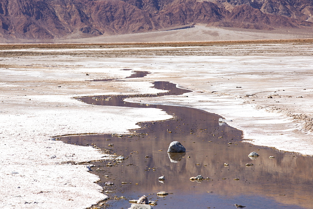 Saline creeks in Death Valley which is the lowest, hottest, driest place in the USA, with an average annual rainfall of around 2 inches, some years it does not receive any rain at all.