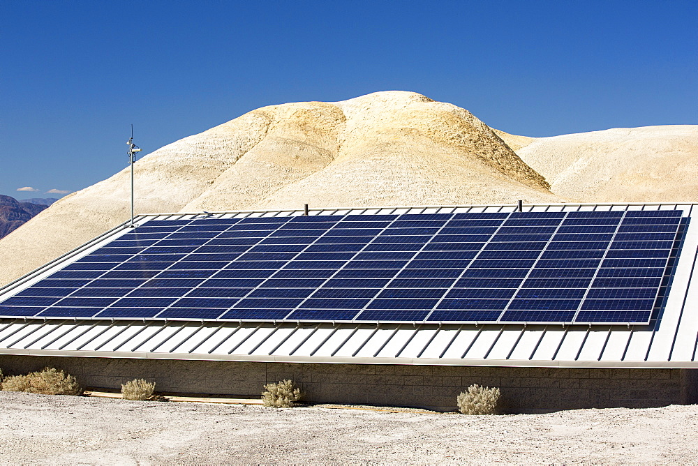 Solar panels amongst Badland scenery in Death Valley which is the lowest, hottest, driest place in the USA, with an average annual rainfall of around 2 inches, some years it does not receive any rain at all.