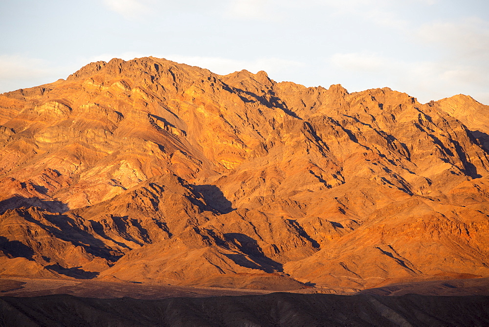 Badland scenery at Zabriskie Point at sunset in Death Valley which is the lowest, hottest, driest place in the USA, with an average annual rainfall of around 2 inches, some years it does not receive any rain at all.