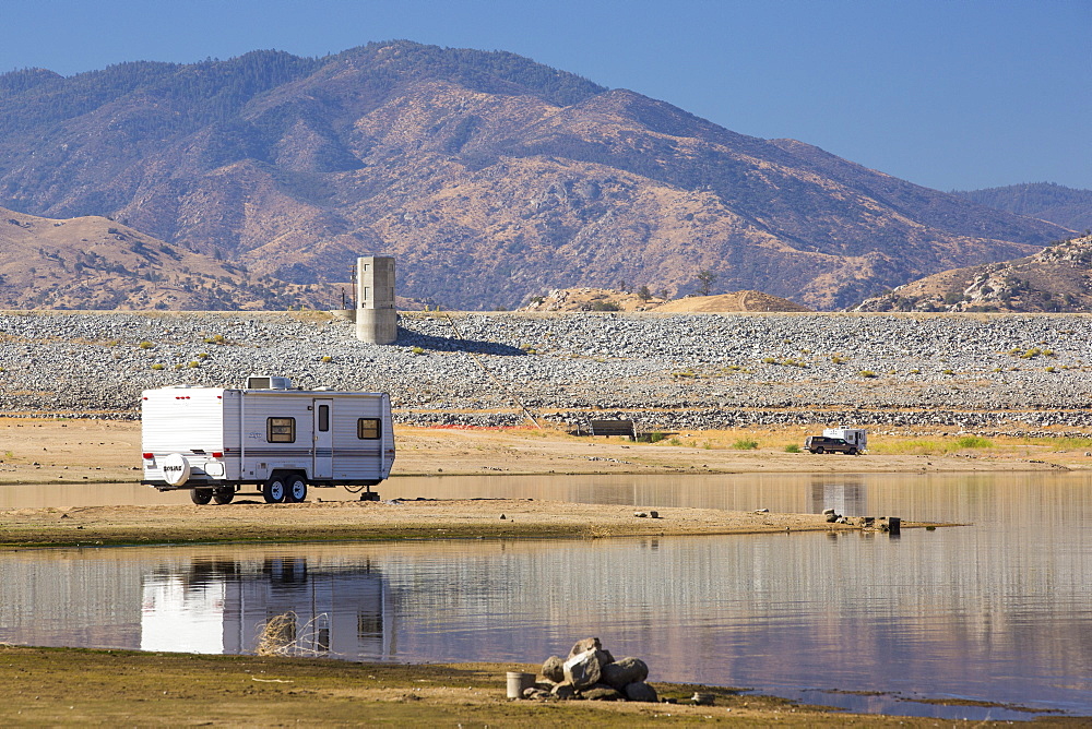 An RV that until recently would be 40 feet underwater on the lake bed of Lake Isabella near Bakersfield, East of California's Central valley which is at less than 13% capacity following the four year long devastating drought. The reservoir has dropped so low, that the water level is below the outflow pipe.