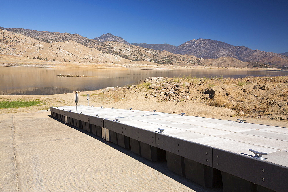 Lake Isabella near Bakersfield, East of California's Central valley is at less than 13% capacity following the four year long devastating drought. The reservoir has dropped so low, that the water level is below the outflow pipe. This shot shows the boat launching jetty, that has been taken as far down the ramp as possible, and is still nowhere near the water level.