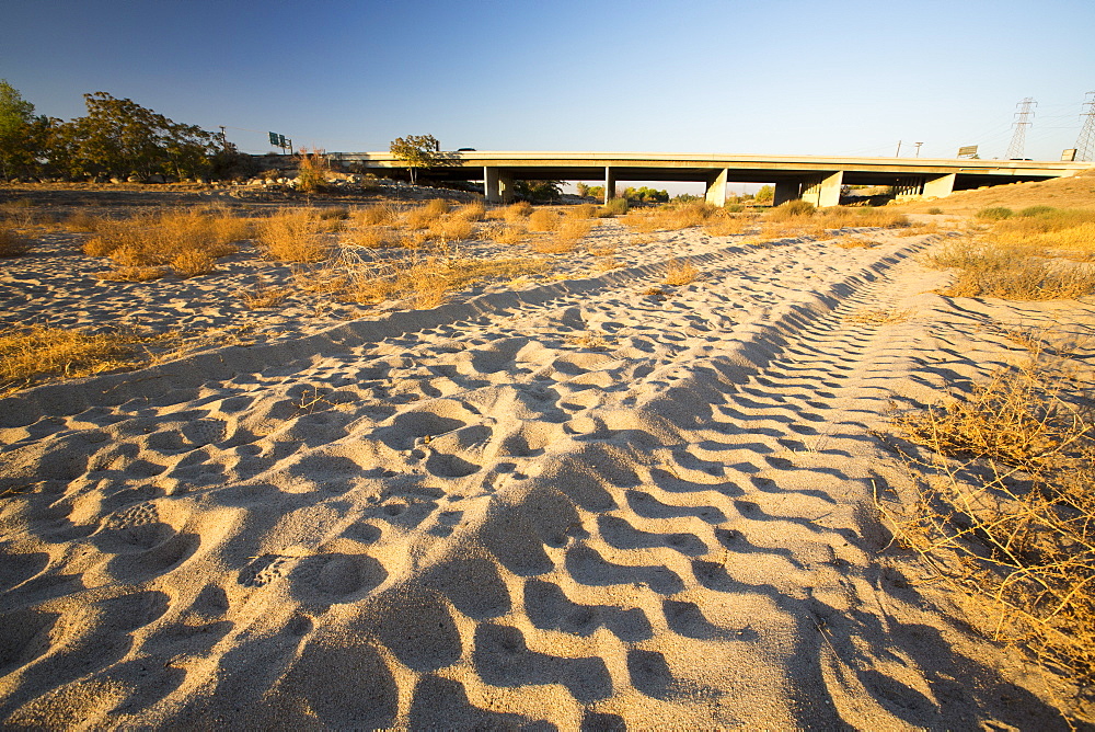 The dried up river bed of the Kern River in Bakersfield, California, USA. Following an unprecedented four year long drought, Bakersfield is now the driest city in the USA. Most of California is in exceptional drought, the highest level of drought classification. 428,000 acres of agricultural land have been taken out of production due to lack of water, thousands of agricultural workers have lost their jobs and one third of all children in California go to bed hungry.