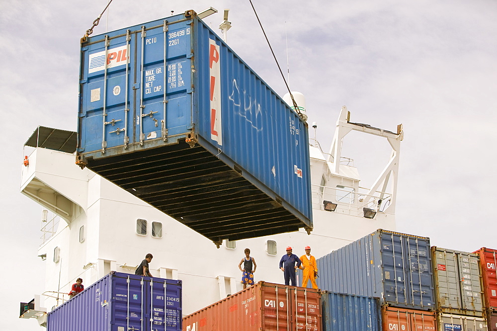 Tuvaluan workers loading containers on the supply ship for Funafuti Atoll, Tuvalu, Pacific