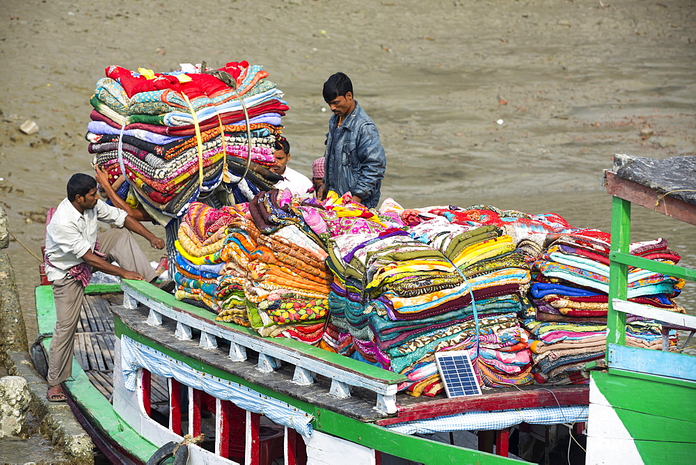 Boats carrying people and goods in the Sunderbans, a low lying area of the Ganges Delta in Eastern India, that is very vulnerable to sea level rise.