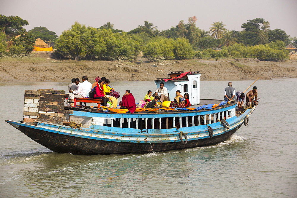 Boats carrying people and goods in the Sunderbans, a low lying area of the Ganges Delta in Eastern India, that is very vulnerable to sea level rise.