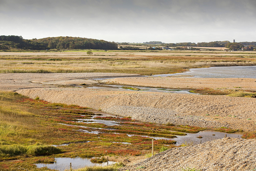 Damage caused to the coastal defences by the December 2013 storm surge at Cley on the North Norfolk coast, UK. The huge waves completely breached the storm beach, and pushed it inland onto the Cley nature reserve.