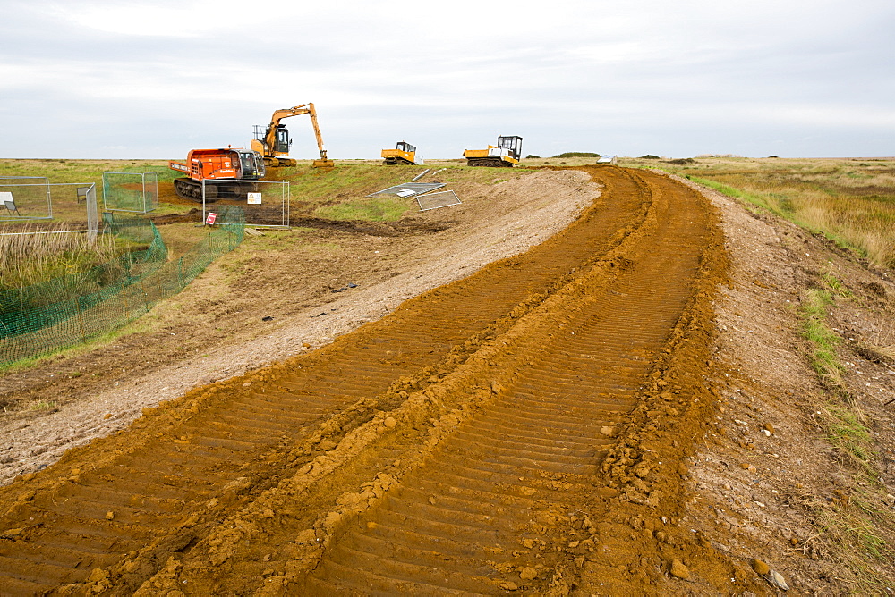 Repairing damage caused to the coastal sea defences in Blakeney, Norfolk by the December 2013 storm surge.