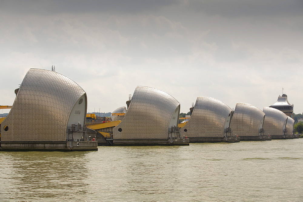 The Thames barrier on the River Thames in London. It was constructed to protect the capital city from storm surge flooding. Recent predictions show it will probably be redundant in around twenty years due to increased stormy weather and sea level rise driven by climate change.