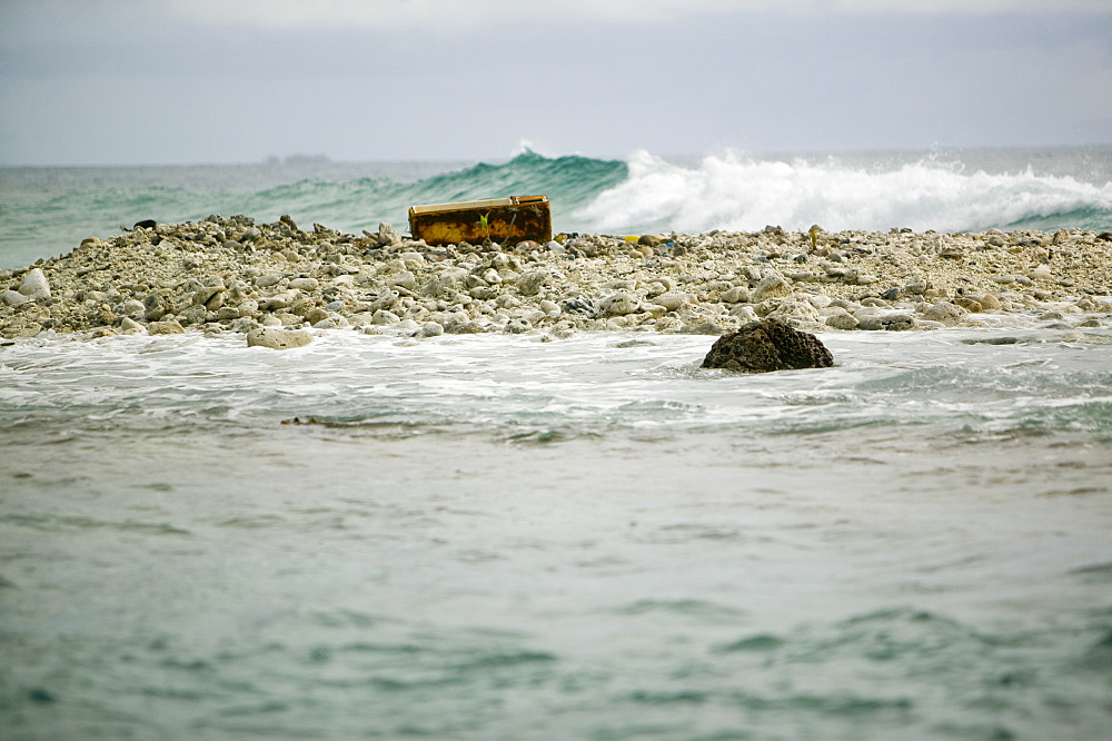 Approaching Tepukasavilivili island, completely destroyed by global warming sea level rise, off Funafuti, Tuvalu, Pacific