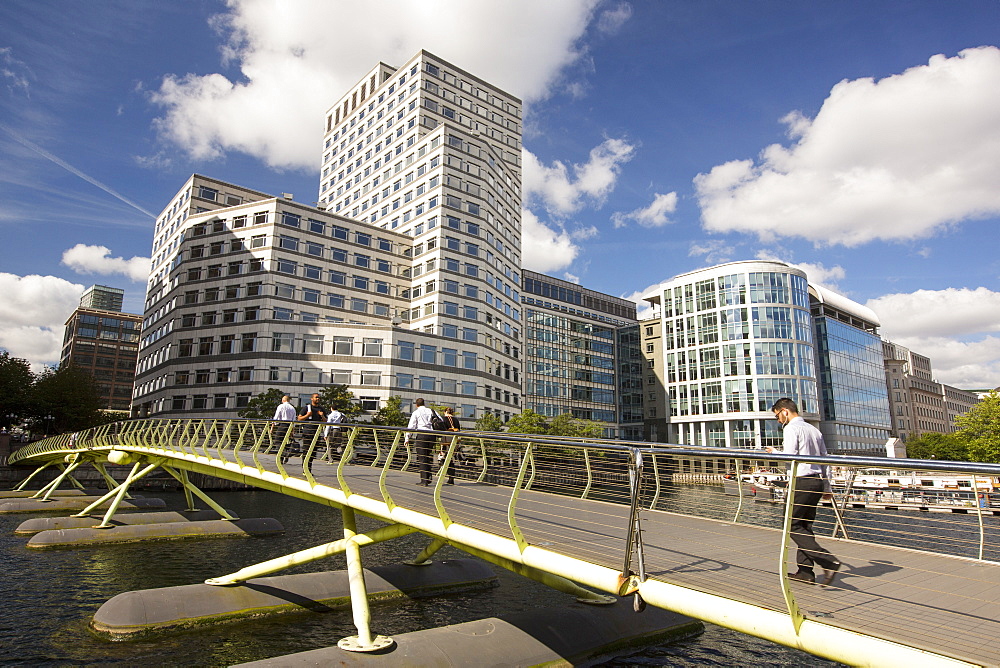 A bridge over docklands towards Canary wharf, London, UK.