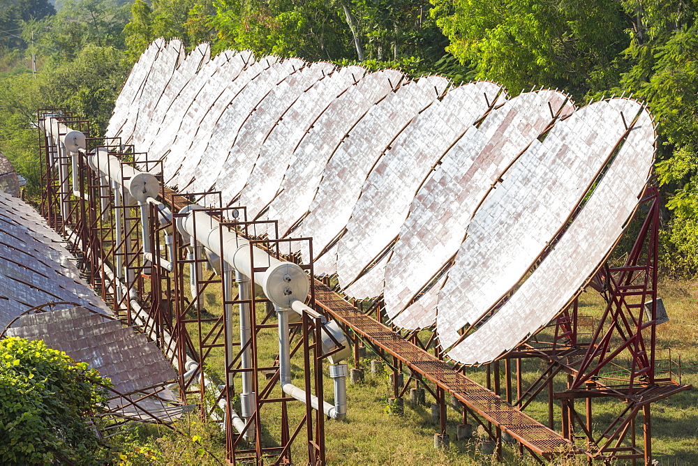 The Muni Seva Ashram in Goraj, near Vadodara, India, is a tranquil haven of humanitarian care. The Ashram is hugely sustainable, next year it will be completely carbon neutral. Its first solar panels were installed in 1984, long before climate change was on anyones agenda. Their energy is provided from solar panels, and wood grown on the estate. Waste food and animal manure is turned inot biogas to run the estates cars and also used for cooking. Solar cookers are also used, and the air conditioning for the hospital is solar run. 70 % of the food used is grown on the estate. They provide an orphanage, schools for all ages, vocational training, care for the elderly, a specialist cancer hospital withstate of the art machinary, and even have a solar crematorium. This shot shows the solar air conditioning for the Ashram's hospital.