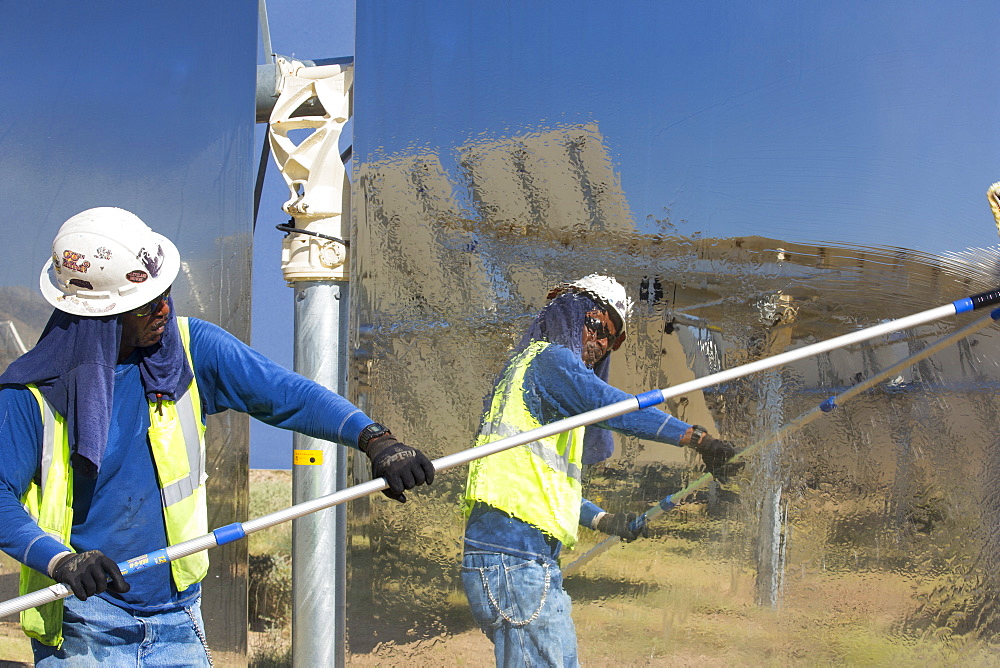 Workers washing the heliostats to maximise reflective power at the Ivanpah Solar Thermal Power Plant in California''s Mojave Desert is currently the largest solar thermal plant in the world. It generates 392 megawatts (MW) and deploys 173,500 heliostats that reflect the suns rays onto three solar towers. It covers 4,000 acres of desert.