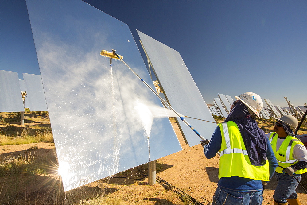 Workers washing the heliostats to maximise reflective power at the Ivanpah Solar Thermal Power Plant in California''s Mojave Desert is currently the largest solar thermal plant in the world. It generates 392 megawatts (MW) and deploys 173,500 heliostats that reflect the suns rays onto three solar towers. It covers 4,000 acres of desert.