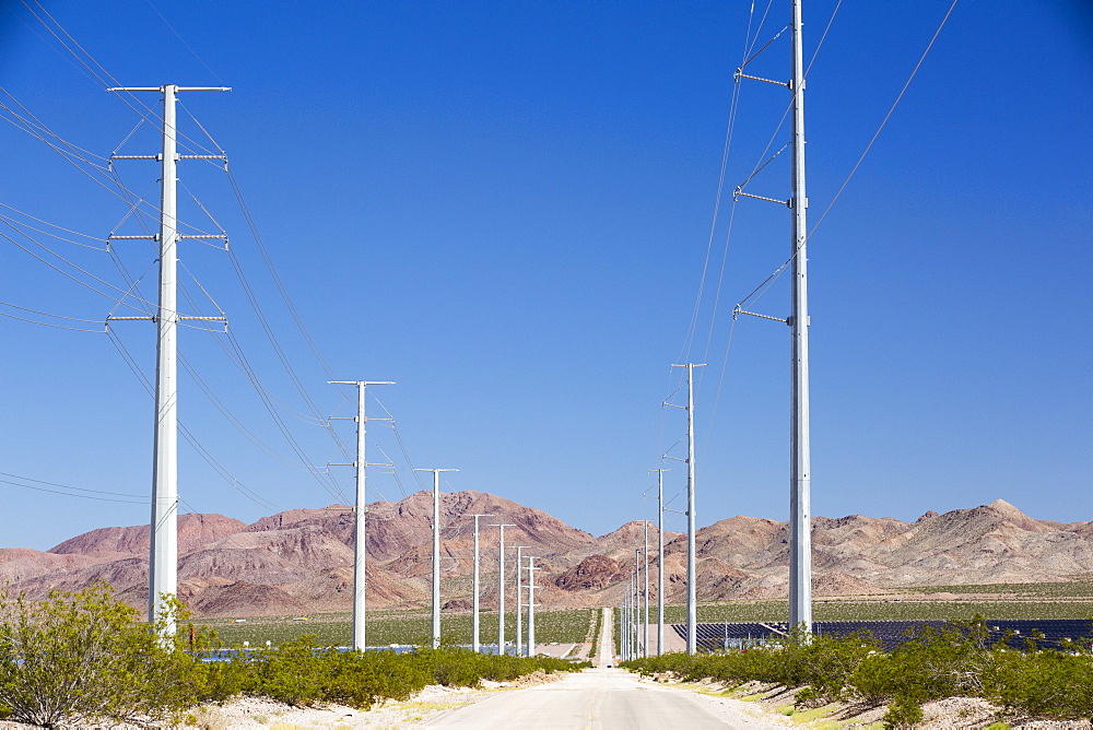 Pylons take renewable electricity from the Copper Mountain Solar power plant in Nevada, USA.