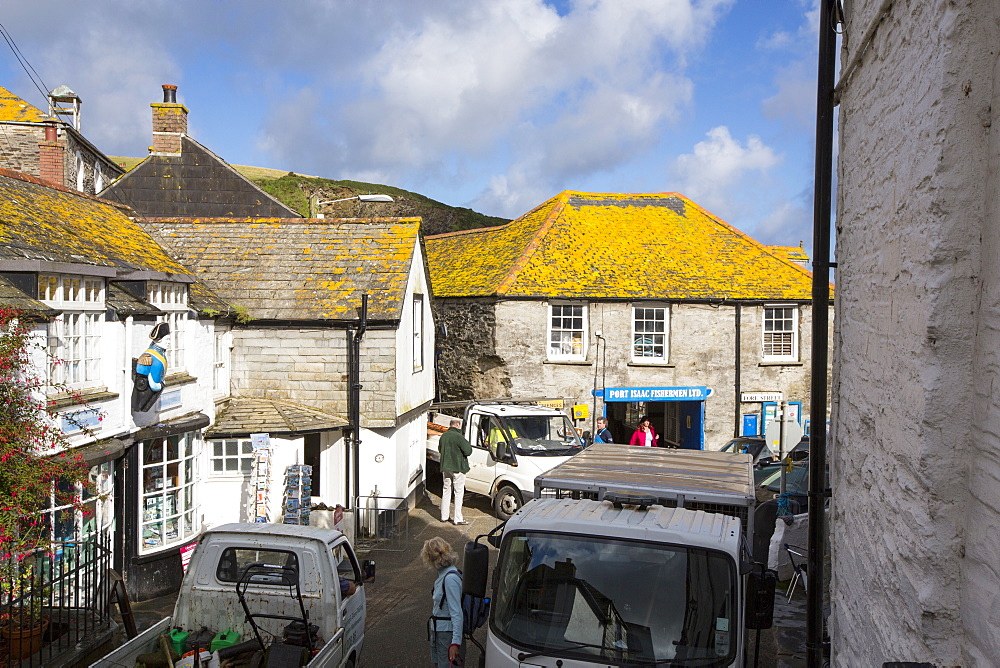 A traffic jam on the narrow Fore Street in Port Isaac in Cornwall, UK, a village made famous by the TV series Doc Martin.