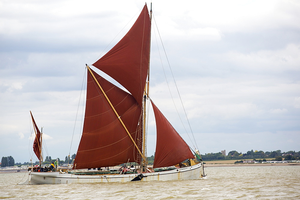 Traditional wooden Smack fishing boats off Brightlingsea, Essex, UK.