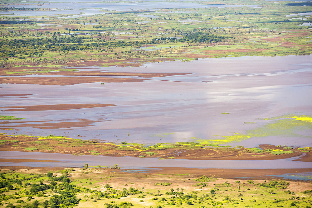 In mid January 2015, a three day period of excessive rain brought unprecedented floods to the small poor African country of Malawi. It displaced nearly quarter of a million people, devastated 64,000 hectares of land, and killed several hundred people. This shot taken from the air shows farmland buried under flood debris, and still flooded land.