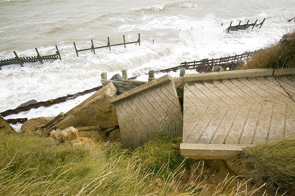 The lifeboat launching ramp destroyed as waves crashing against the coast at Happisburgh on the fastest eroding section of the UK coast, Norfolk, England, United Kingdom, Europe