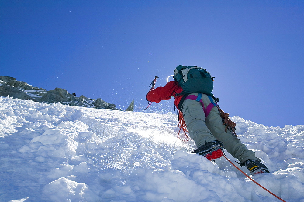 Climbing ice on the Grand Montets above Chamonix, Haute Savoie, France, Europe