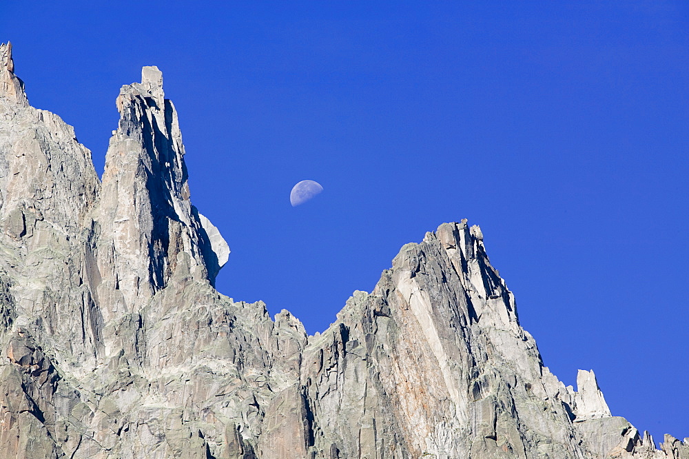 Moon rising over the Aiguille Du Grepon near Chamonix, Haute Savoie, France, Europe