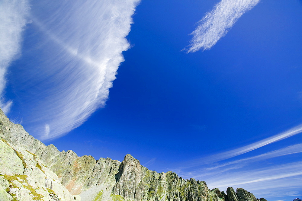 High level clouds above the Aiguille Rouge National Park near Chamonix, Haute Savoie, France, Europe