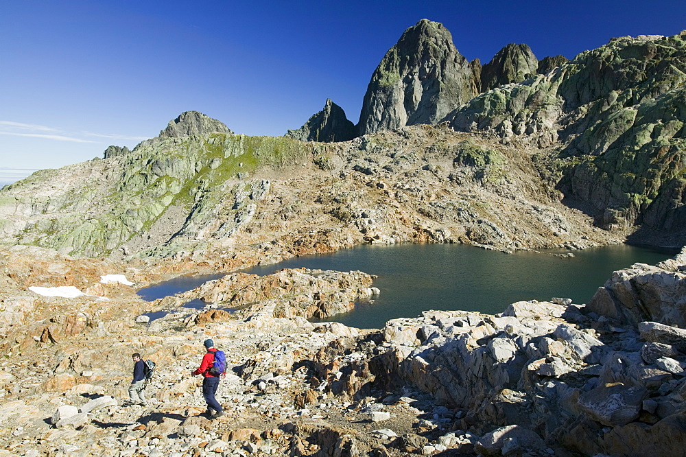 Walkers at Lac Noir in the Aiguille Rouge National Park near Chamonix, Haute Savoie, France, Europe