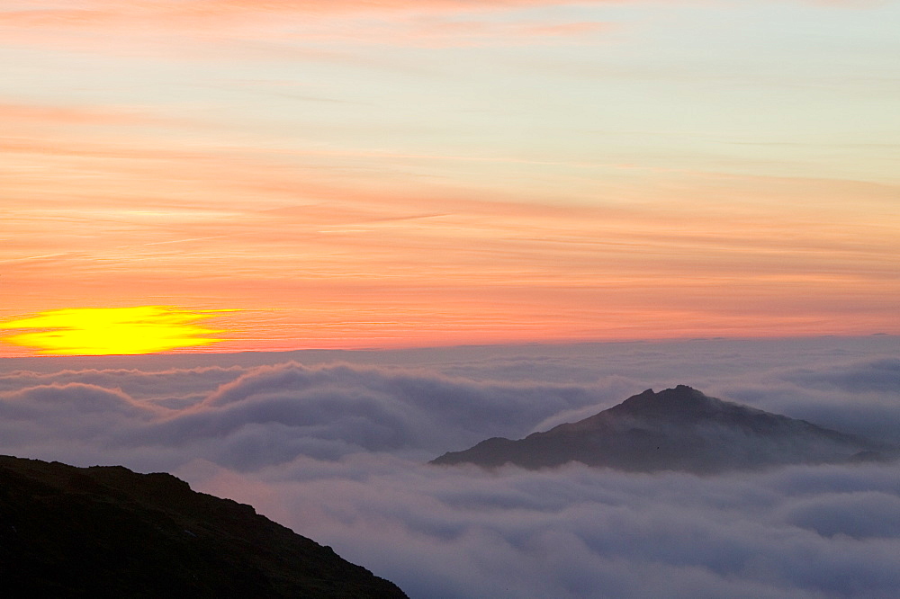 Harter Fell above the clouds on Wet Side Edge in the Lake District, Cumbria, England, United Kingdom, Europe