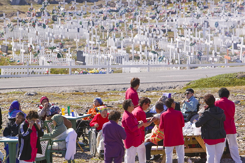 The old folks of Ilulissat having a day out in front of the town's cemetery, Greenland, Polar Regions